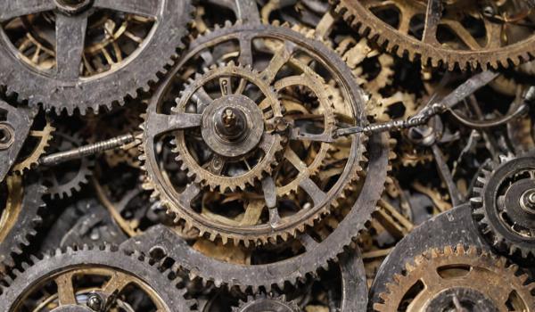 Clock movement gears and springs being repaired